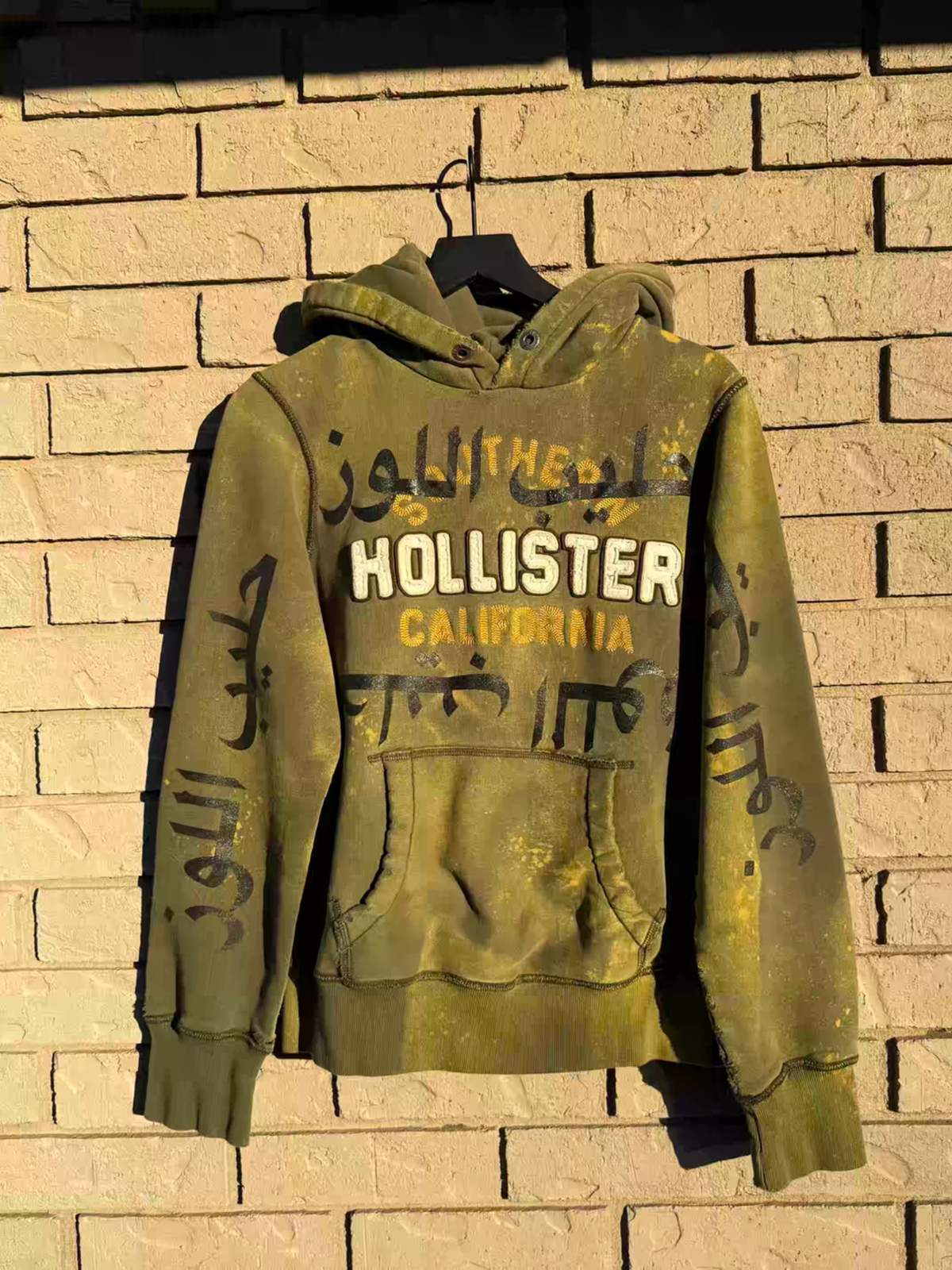distressed arabic hollister hoodie