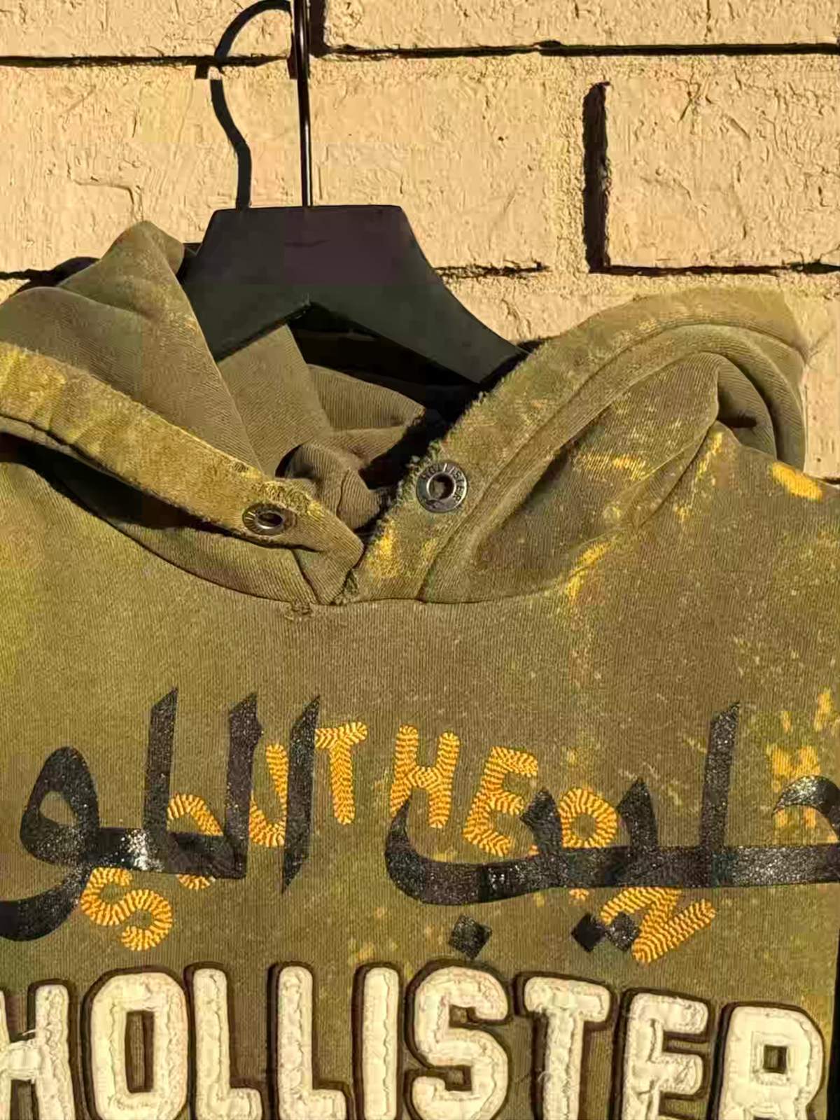 distressed arabic hollister hoodie